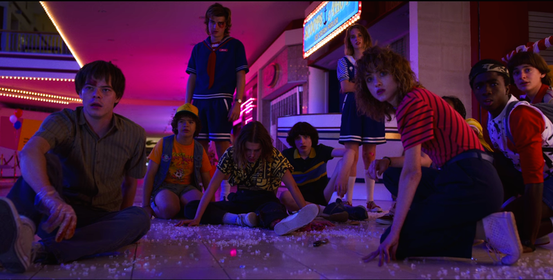 Charlie Heaton, Gaten Matarazzo, Joe Keery, Millie Bobby Brown, Finn Wolfhard, Maya Hawke, Natalia Dyer, Priah Ferguson (obscured), Caleb McLaughlin, Noah Schnapp